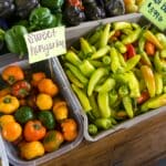 Baldwyn Farmers Market Building Underway, Due by January Assorted peppers on display at a farmers market, illustrating the Baldwyn farmers market building project