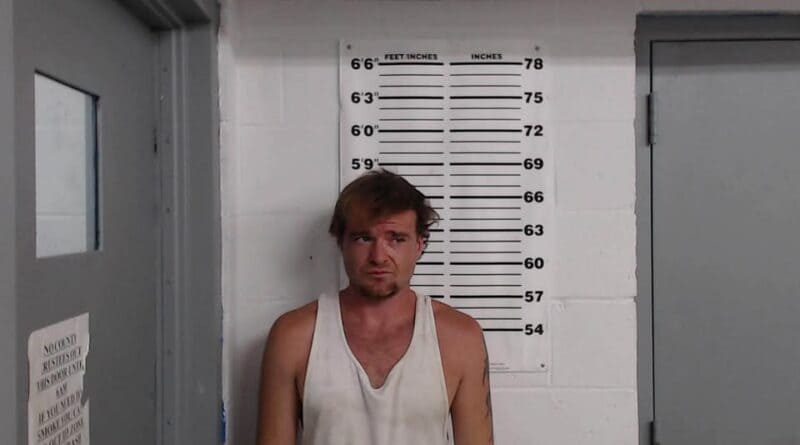 Two booking-style mugshots show a man and a woman standing in front of height-chart backdrops.