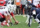 Corinth Football Game Moved to Thursday Ahead of Storms High school football teams line up at the line of scrimmage, illustrating the Corinth football game moved to Thursday