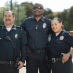 Corinth Police Officers Mentor ACTC Law Students Group of uniformed police officers smiling together outdoors, illustrating Corinth police officers mentoring students