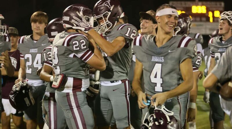 Kossuth Aggies football players celebrate on the sideline after beating Tishomingo County 31-13 on Sept. 11, 2026.