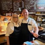 Abe's Grill Reopens in Corinth, Carrying On Mr. Abe Whitfield's Legacy Mrs. Terri Whitfield and Mr. Ryan behind the counter inside Abe's Grill in Corinth, beneath the restaurant's handwritten menu board