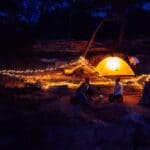The 5 Best Portable Power Stations for Alcorn County Homes and Hunting Camps A cozy campsite illuminated by string lights and a glowing tent under a night sky (Photo by K on Pexels)