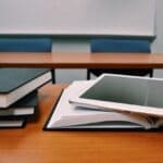 Alcorn, Corinth Schools Get First State Grades Under New Scale Classroom desks with books and a tablet, illustrating Alcorn school grades released by the state