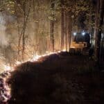 Night Fire: Forestry Crews Battled 3 Wildfires in Tishomingo County, Including 2-Acre Area 13 Blaze A bulldozer works along the fireline at night during the Area 13 Wildfire in northwest Tishomingo County on September 29 — photo by Mississippi Forestry Commission Area Forester Drew Fletcher