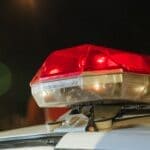 Baldwyn Police Arrest 3 Men in Child Sex Crime Cases Police car red siren light at night, illustrating a Baldwyn police arrest