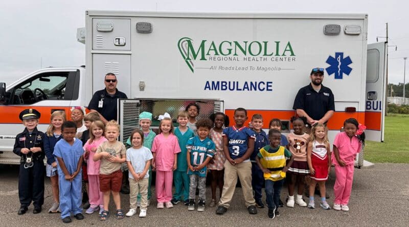 Corinth Elementary Career Day students dressed as future professionals pose with Magnolia Regional Health Center ambulance crew