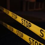 Corinth Shooting Near Scott, Dorsey Streets Under Investigation Yellow police tape at a crime scene, illustrating the Corinth shooting investigation