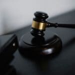 Jeremy Hudson Named Assistant District Attorney Wooden judge's gavel on a dark desk, illustrating the new assistant district attorney appointment