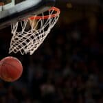 NEMCC Basketball Schedule Has 17 Home Games for 2026-27 Basketball dropping through a hoop, illustrating the NEMCC basketball schedule