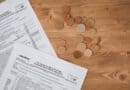 Prentiss County Budget Keeps Tax Rate Flat at 65.7 Mills Tax forms and coins on a table illustrating the Prentiss County tax rate