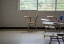 Prentiss County Schools Earn Fifth Straight A Rating Empty classroom with school desks by a large window, illustrating the Prentiss County schools A rating