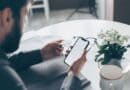 Prentiss County Sheriff Warns of Utility Bill Scam Calls Person holding a credit card and smartphone, illustrating a utility bill scam payment demand