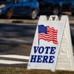 Tishomingo County Election Nov. 3: What's on the Ballot Vote Here sign outside a polling place, illustrating the Tishomingo County election on Nov. 3